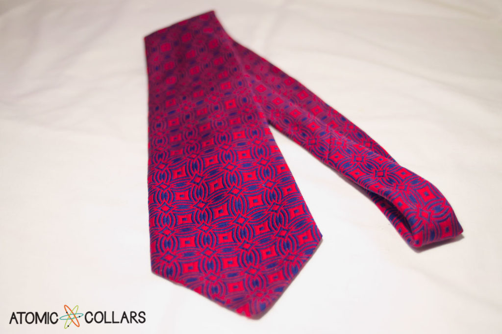 Necktie with bold red and blue geometric pattern to be turned into a dog collar