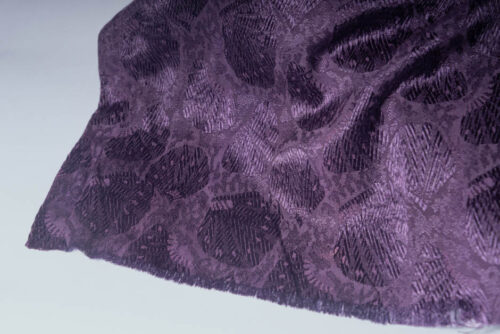 Deep purple shell patterned material waiting to be a medieval dog collar