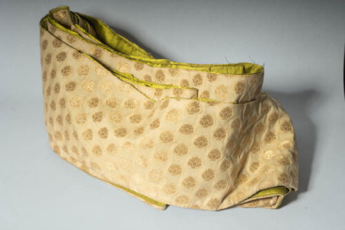 Golden lotus flower pattern on soft gold background waiting to be turned into a medieval dog collar